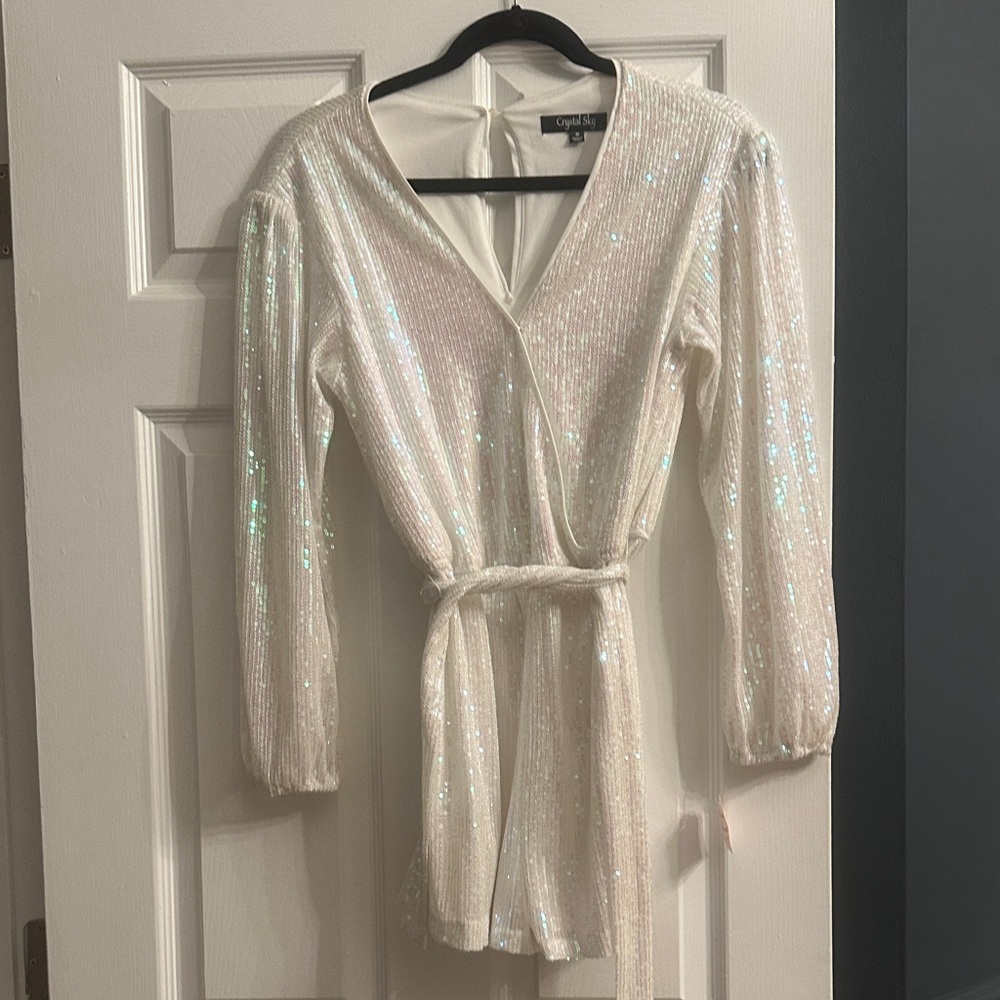 White Sequin shorts romper with belt and cute peep hole button in Back.